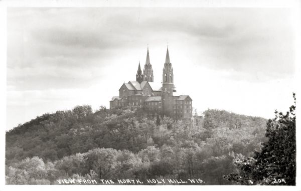 View of the Carmelite monastery on Holy Hill from the north. Caption reads: "View from the North, Holy Hill, Wis."
