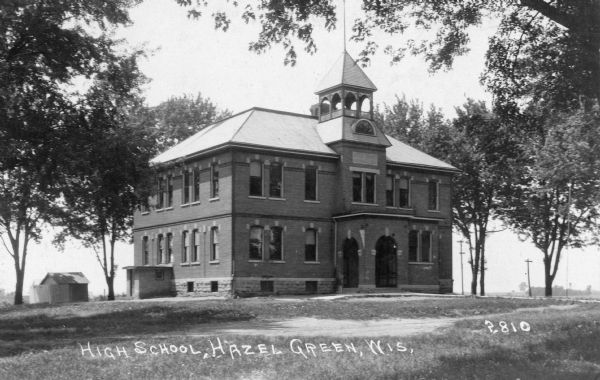 View of a high school. Caption reads: "High School, Hazel Green, Wis."