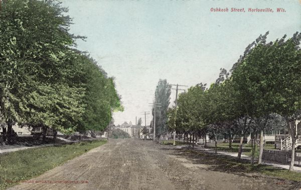 View down tree-lined Oshkosh Street. Caption reads: "Oshkosh Street, Hortonville, Wis."
