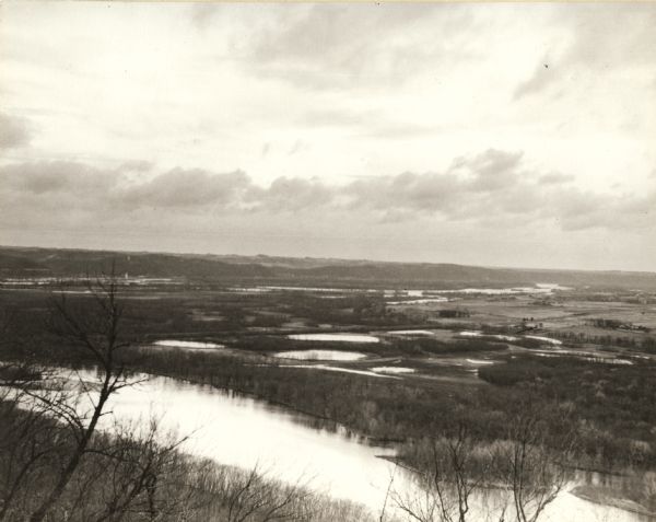 Wyalusing State Park in the Prairie du Chein vicinity. The Wisconsin River is in the foreground and the Mississippi river can be seen below with distant bluffs in the center. McGregor, Iowa is visible at left center.