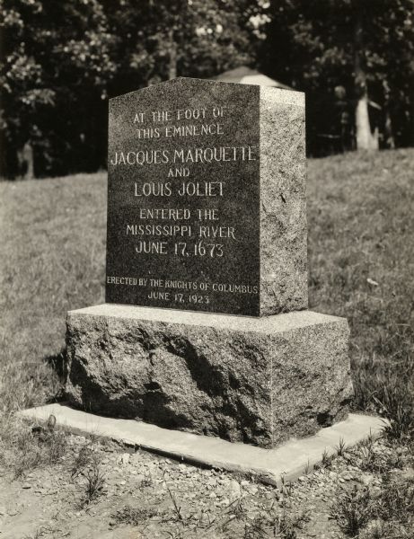 This historical marker was erected in commemoration of the French explorers Father Jacques Marquette and Louis Joliet in the Wyalusing State Park. The two men are credited with being the first white people to journey down the Wisconsin River to its confluence with the Mississippi River--a point they reached on June 17, 1673. The marker was erected by the Knights of Columbus on the 250th anniversary of the event.