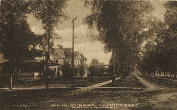 Main Street looking east in Whitewater. Caption reads: "Main Street, Looking East, Whitewater, Wis."