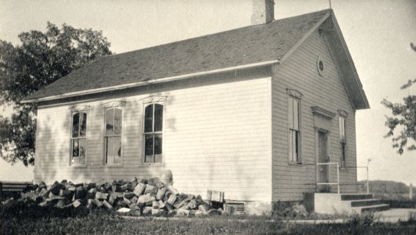 Exterior view of the school in which Ella Wheeler Wilcox taught. It was destroyed by fire in July, 1926.
