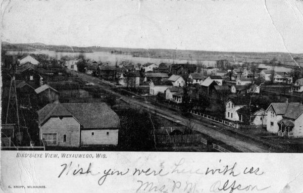 Elevated view of the Weyauwega commercial district. Caption reads: "Bird's-Eye View, Weyauwega, Wis."