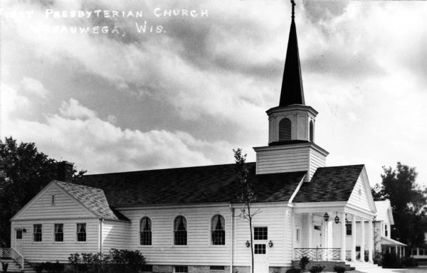 View towards the front and left side of the church. Caption reads: "First Presbyterian Church, Weyauwega, Wis."