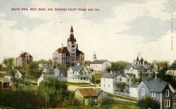 View of West Bend featuring the Washington County Court House in the distance. Caption reads: "South View, West Bend, Wis. Showing Court House and Jail."