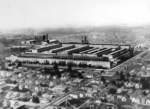 The city of West Allis, including an artist's rendition of the Allis-Chalmers Manufacturing Company. One of the largest machinery manufacturing plants in America, it produces turbine engines, gas producer engines, public utility power plant, electrical machinery, mining machinery and flouring mill machinery.