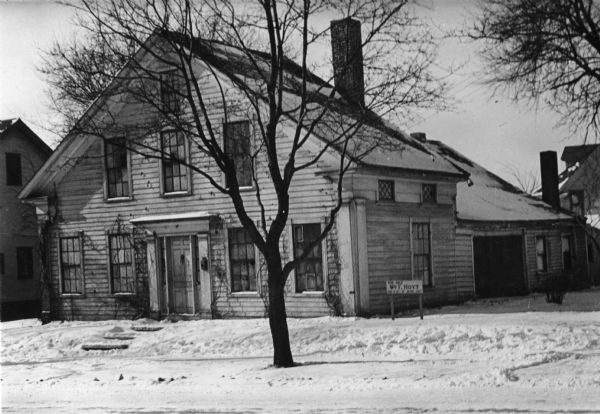 The Lowell Damon house, east elevation or front. Snow is on the ground.
