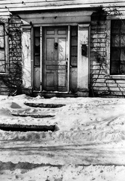 The main entrance to the Lowell Damon home. Snow is on the ground.