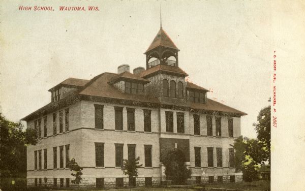 Exterior view of the Wautoma High School. Caption reads: "High School, Wautoma, Wis."