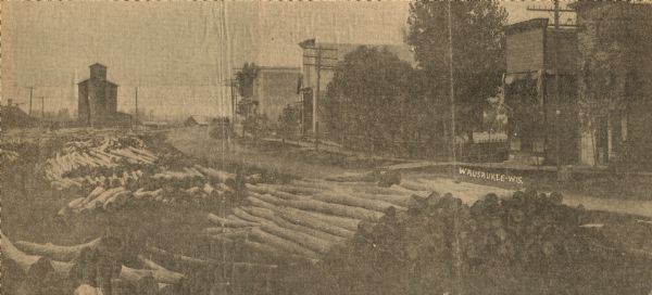 H.P. Christ Feed Mill. The first building across the street is the Atlas Hotel which was located at the site of the present Milo Howarth senior home. Other buildings shown include the office of Dr. Seller, Bangert's tailor shop and the Independent Order of Forester's hall. Excerpt from "Peshtigo Times".