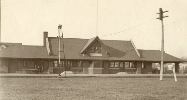 Front view of the Wausau Railroad Station with power lines in the foreground.