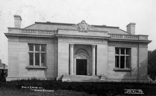 Exterior view of the Wausau Public Library before landscaping. Caption reads: "Public Library, Wausau, Wis."