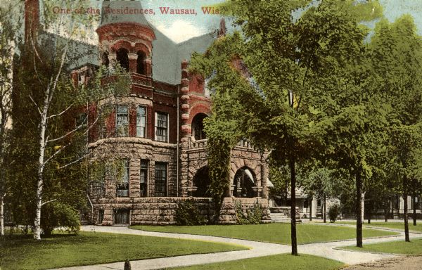 One of the residences of D. L. Plumer, president of the 1st National Bank. The building was razed in 1971. Caption reads: "One of the Residences, Wausau, Wis."