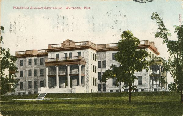 Front exterior view of the Waukesha Springs Sanitarium. Caption reads: "Waukesha Springs Sanitarium, Waukesha, Wis."