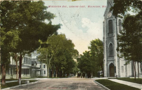View down center of Wisconsin Avenue, looking east. Caption reads: "Wisconsin Avenue, Looking East, Waukesha, Wis."