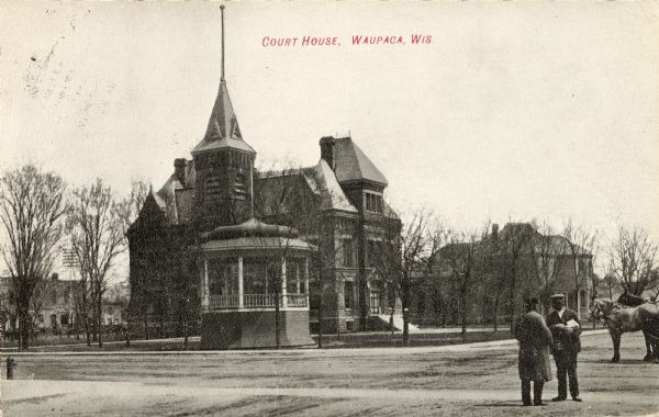 Exterior view of the Waupaca courthouse. Caption reads: "Court House, Waupaca, Wis."