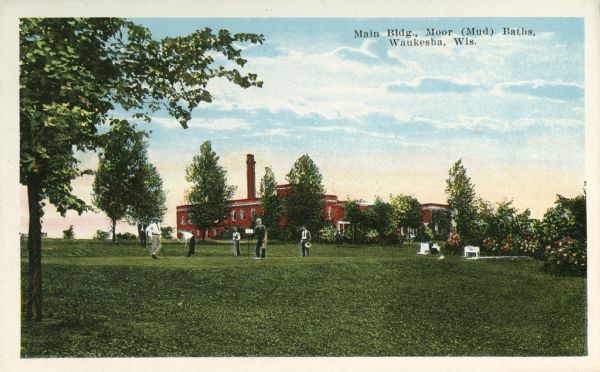 View of the main building in the distance, and in the foreground a golf course of the Moor (Mud) Baths. Caption reads: "Main Bldg., Moor (Mud) Baths, Waukesha, Wis."