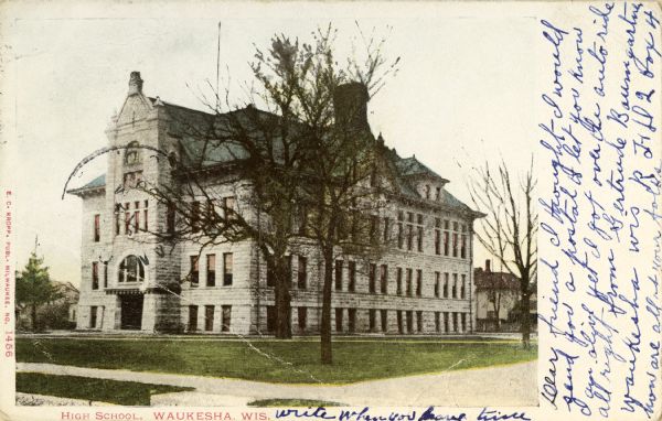 Exterior view of a high school. Caption reads: "High School, Waukesha, Wis."