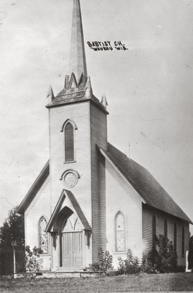 Exterior view of a Baptist church. Caption reads: "Baptist Ch. Wausau Wis."