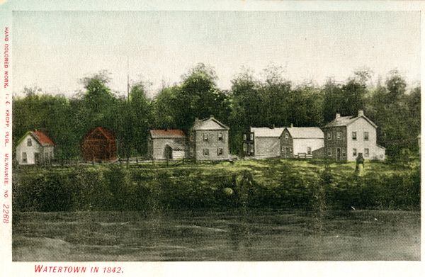 View across the river towards several residences on the opposite shoreline. Caption reads: "Watertown in 1842."