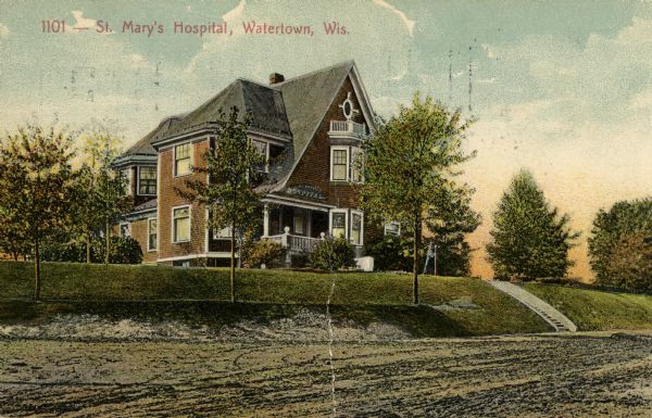 View across road towards St. Mary's Hospital. Caption reads: "St. Mary's Hospital, Watertown, Wis."