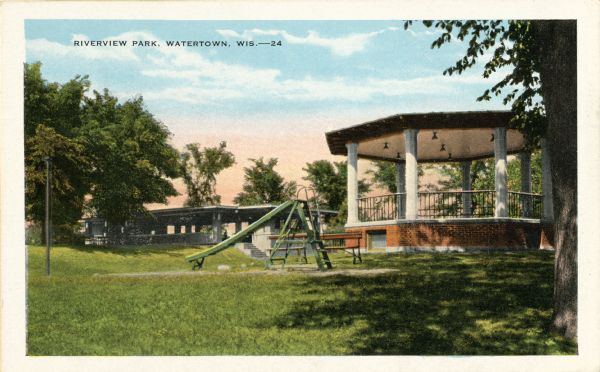 View of Riverview Park, with gazebo and slide in foreground. Caption reads: "Riverview Park, Watertown, Wis."