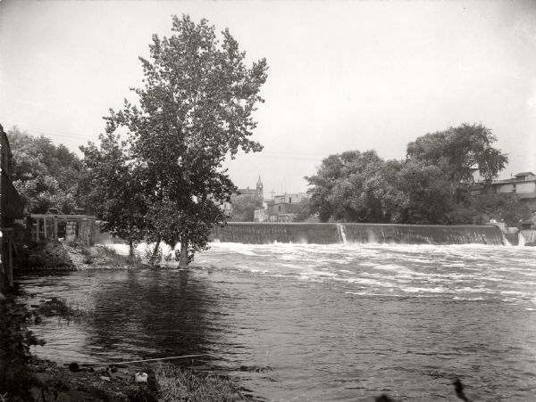 A dam stretching acrossed the Rock River near the Empire mills, later the Globe mills.