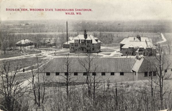 Elevated view of the Wisconsin State Tuberculosis Sanatorium. Caption reads: "Bird's-Eye View, Wisconsin State Tuberculosis Sanatorium, Wales, Wis."