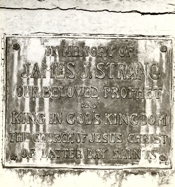 The inscription on a monument in memory of James J. Strang.