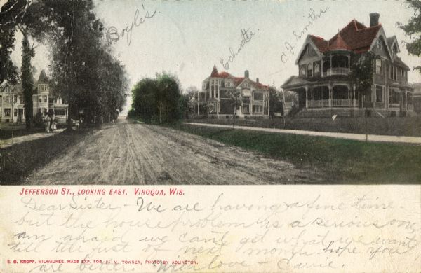View down unpaved Jefferson Street looking east, with large houses on both sides. Caption reads: "Jefferson St., Looking East, Viroqua, Wis." Handwritten near three houses: "Boyle's", "Echardte"(?), "C. J. Smiths".