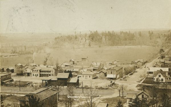 Elevated view of Union Center, with fields and bluffs in the background. Caption reads: "Union Center, Wis."