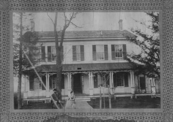 Framed view of the Captain Samuel Fowler house, with a couple posed outside. Caption reads: "J.E. Eggleston, Princeton, Wis."