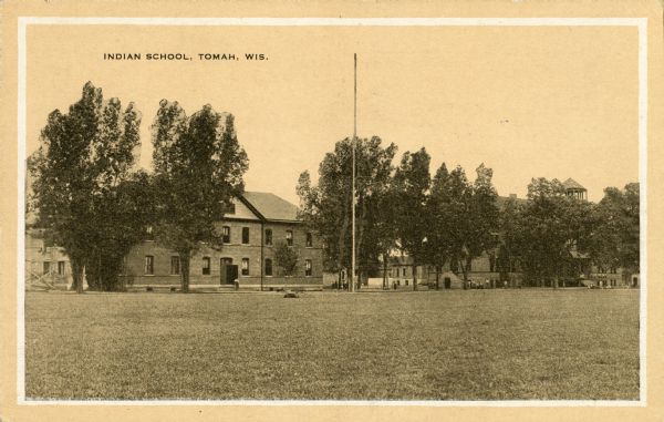 View across lawn toward the Indian School. Caption reads: "Indian School, Wis."