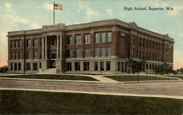 Exterior view across street towards a high school. Caption reads: "High School, Superior, Wis."