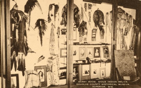 Dipslay of Sioux Indian Relics. Caption reads: "Barry Room, Sioux Indian Relics, Douglas County Historical Museum, Superior, Wis."