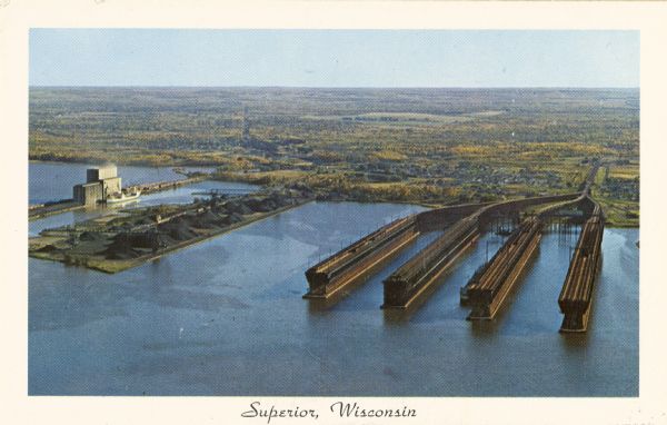 Aerial view with docks in the foreground. Caption reads: "Superior, Wisconsin."