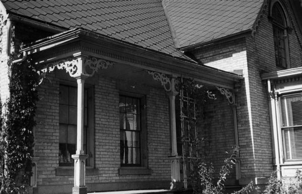 Close-up view of the porch of a Gothic Revival house located at 150 Center Street.