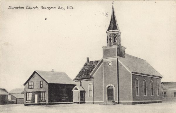 Exterior view of the church. Caption reads: "Moravian Church, Sturgeon Bay, Wis."