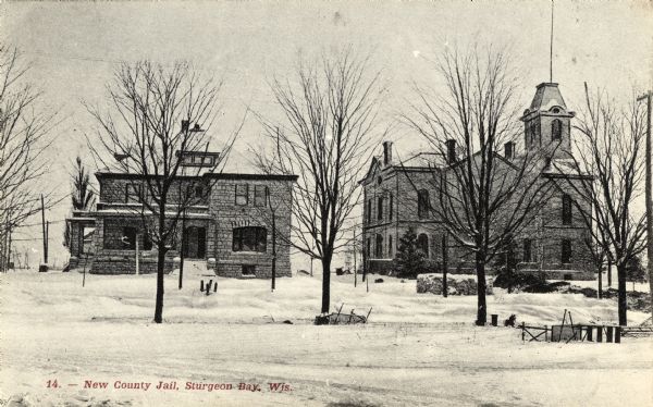 Exterior view of the county jail in Sturgeon Bay. Caption reads: "New County Jail, Sturgeon Bay, Wis."