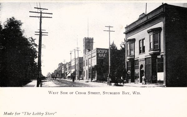 View from left sidewalk towards the west side of Cedar Street. Caption reads: "West Side of Cedar Street Sturgeon Bay, Wis."