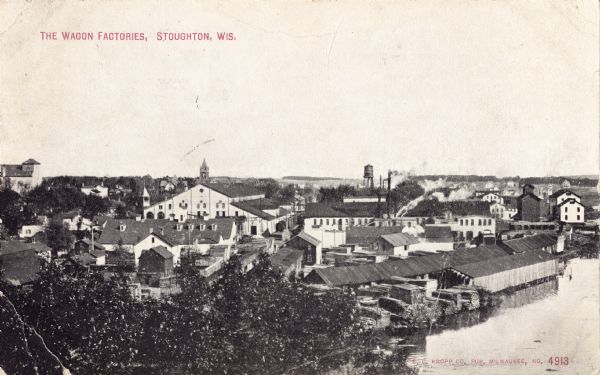 Elevated view of the wagon factories. Caption reads: "The Wagon Factories, Stoughton, Wis."