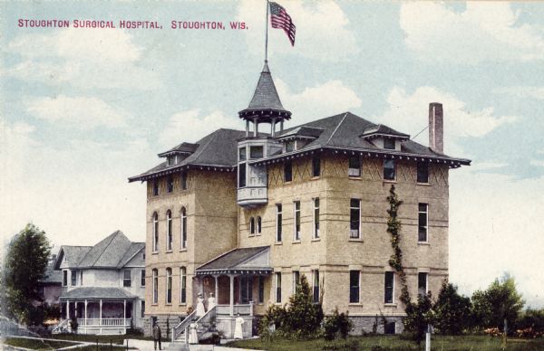 Exterior view of the hospital, with several people standing on and around the front porch. Caption reads: "Stoughton Surgical Hospital, Stoughton, Wis."