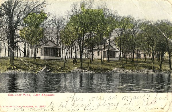 View across water toward Colladay Park on Lake Kegonsa. Cabins are on the shoreline among trees. Caption reads: Colladay Park, Lake Kegonsa."