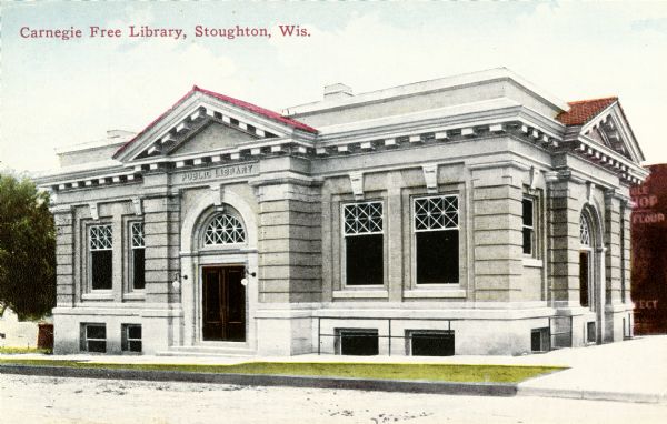 Exterior view of Carnegie Free Library. Caption reads: "Carnegie Free Library, Stoughton, Wis."