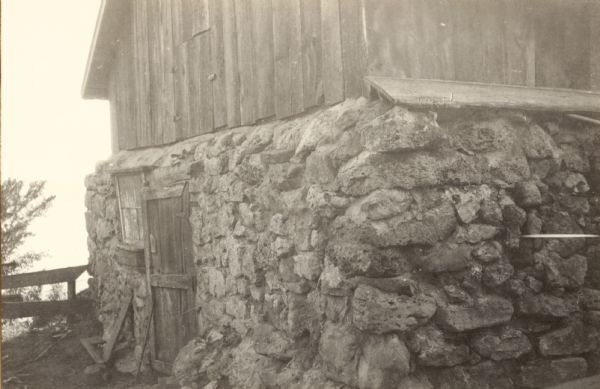 View of a barn made from stone salvaged from the "site of the old log building" at the alleged site of Fort St. Antoine.