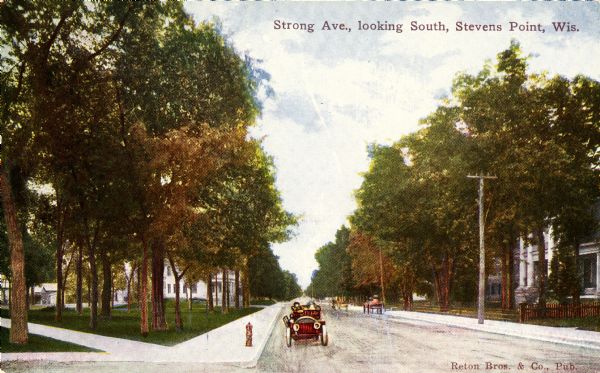 View down the avenue, with an automobile approaching. Caption reads: "Strong Ave., looking South, Stevens Point, Wis."