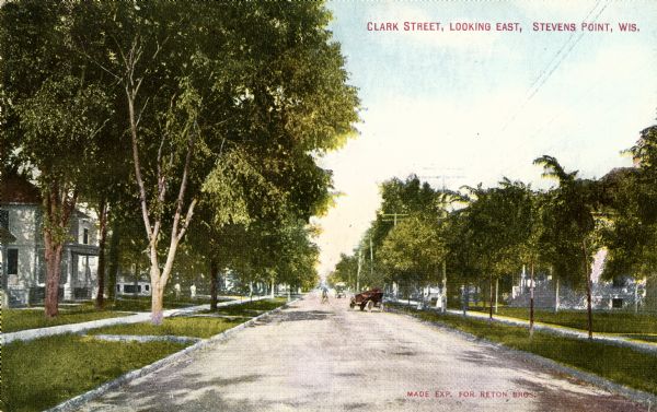 View down center of street. Caption reads: "Clark Street, Looking East, Stevens Point, Wis."