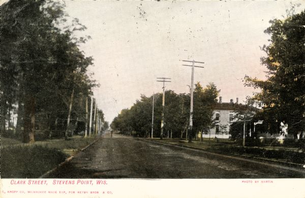 View down center of street. Caption reads: "Clark Street, Stevens Point, Wis."