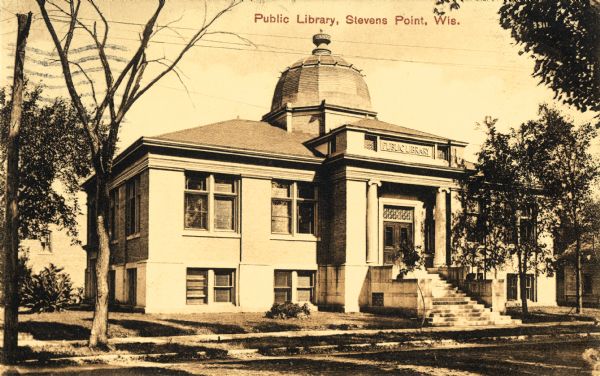 View across street towards the library. Caption reads: "Public Library, Stevens Point, Wis."